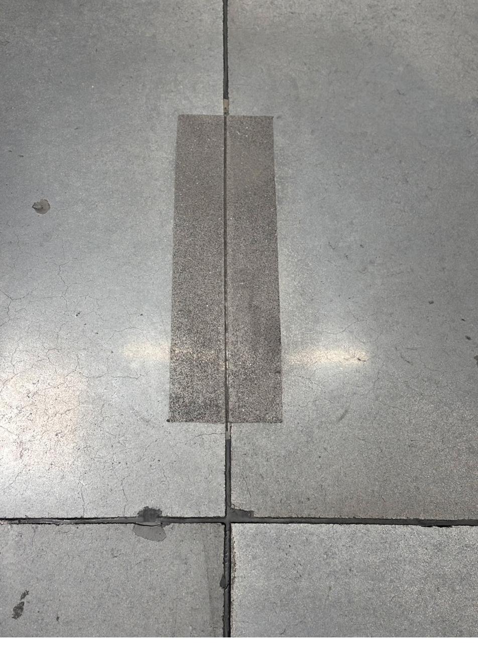 Repaired concrete control joint in a warehouse floor